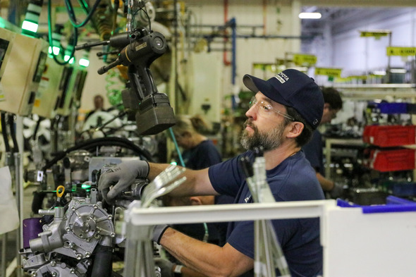 TMH Employee Working on Line